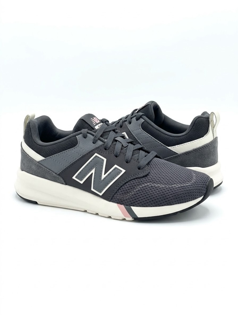 New Balance Men's Dark Gray and White Athletic Sneakers with Pink Accent